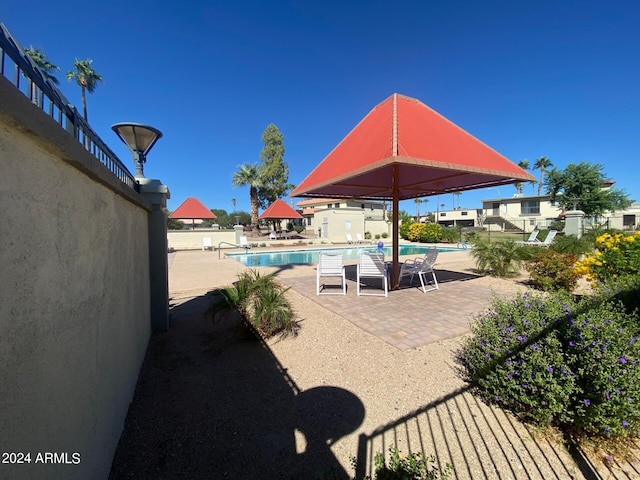 view of patio with a community pool