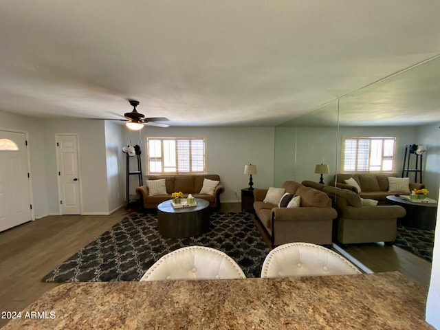 living room with a healthy amount of sunlight, wood-type flooring, and ceiling fan