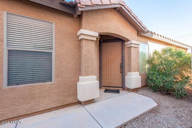 doorway to property with a patio