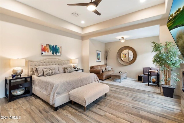 bedroom with wood-type flooring and ceiling fan