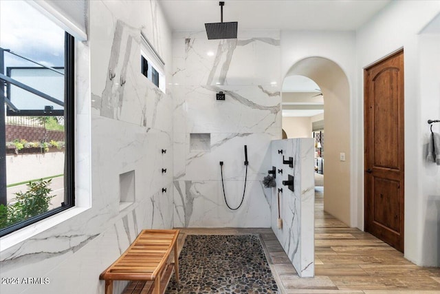 interior space featuring tile walls and light hardwood / wood-style flooring