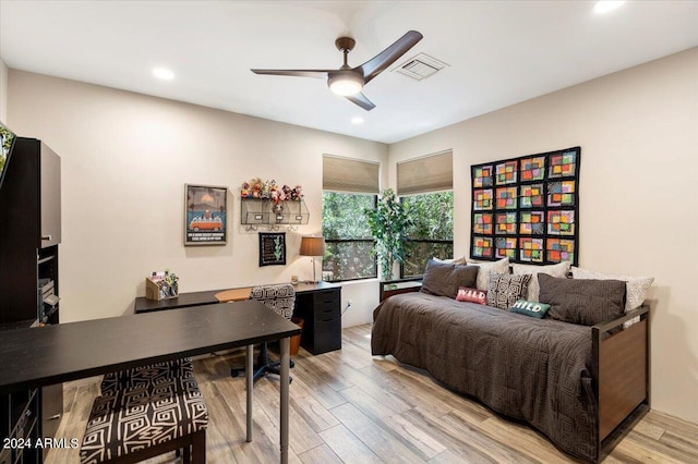 bedroom featuring light hardwood / wood-style flooring and ceiling fan