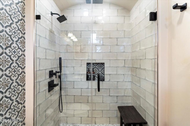 bathroom with vaulted ceiling and walk in shower