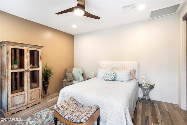 bedroom featuring hardwood / wood-style floors and ceiling fan