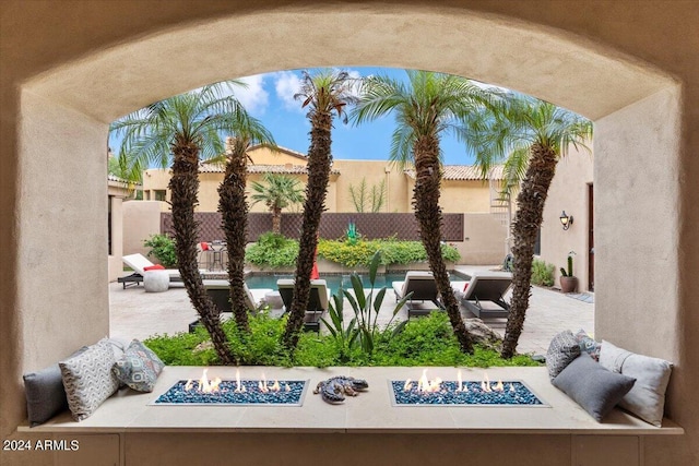 view of patio with an outdoor fire pit