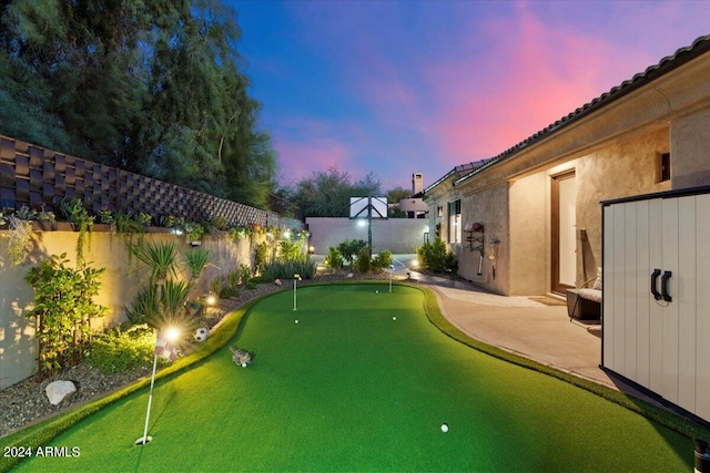 view of yard at dusk