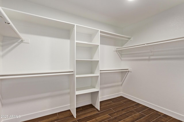 spacious closet with wood finish floors