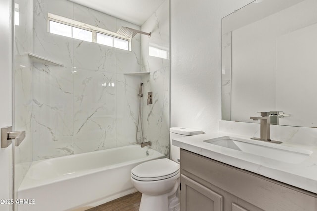 full bath with vanity, toilet, wood finished floors, and shower / bath combination