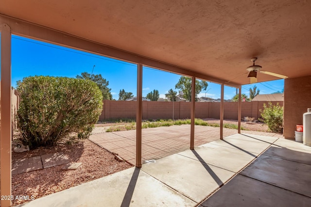 view of patio / terrace with a fenced backyard and a ceiling fan