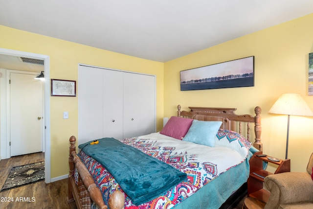 bedroom with hardwood / wood-style floors and a closet