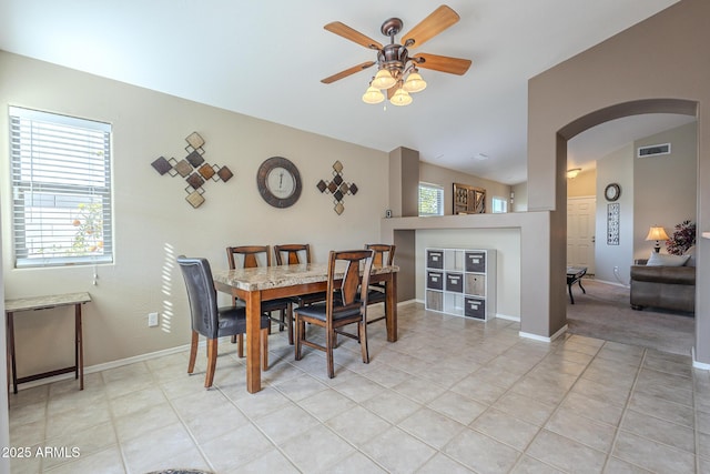 tiled dining room with ceiling fan