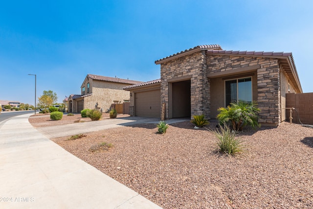 view of front of home with a garage