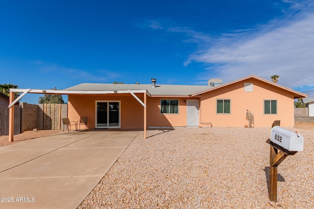 back of property featuring a patio area