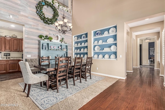 4463 S Oregon Ct, Chandler, AZ 85248 - dining space with a chandelier, dark wood-style floors, baseboards, and a high ceiling