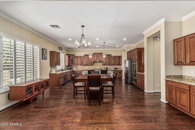 4463 S Oregon Ct, Chandler, AZ 85248 - dining space with a chandelier, recessed lighting, dark wood-style flooring, crown molding, and baseboards