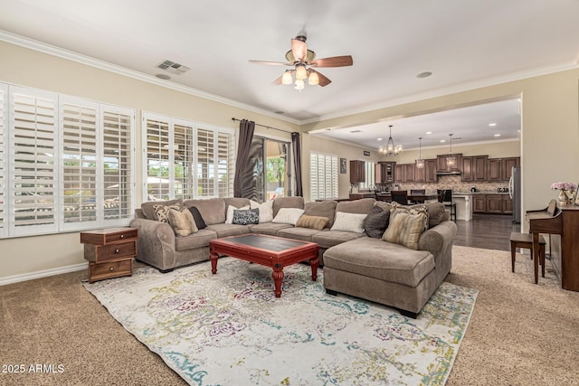4463 S Oregon Ct, Chandler, AZ 85248 - living area featuring ceiling fan, ornamental molding, a chandelier, baseboards, and dark carpet