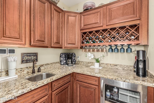 4463 S Oregon Ct, Chandler, AZ 85248 - kitchen with a sink, light stone counters, stainless steel microwave, and brown cabinetry