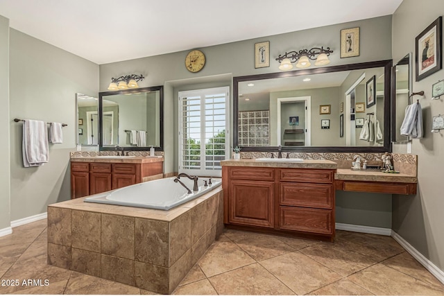 4463 S Oregon Ct, Chandler, AZ 85248 - bathroom featuring a bath, two vanities, and tile patterned flooring