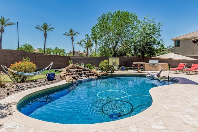 4463 S Oregon Ct, Chandler, AZ 85248 - view of swimming pool featuring an outdoor kitchen, a patio, and a fenced backyard