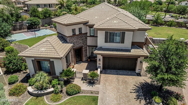 4463 S Oregon Ct, Chandler, AZ 85248 - view of front of home with stucco siding, decorative driveway, a garage, and a tiled roof