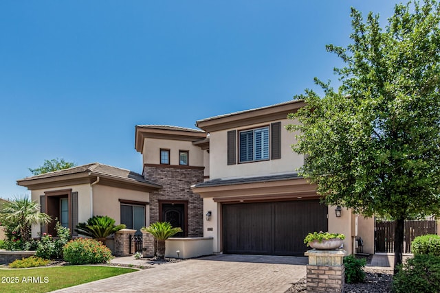 4463 S Oregon Ct, Chandler, AZ 85248 - view of front of home with stucco siding, decorative driveway, an attached garage, a tile roof, and brick siding