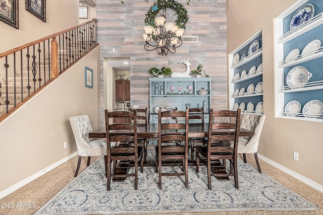 4463 S Oregon Ct, Chandler, AZ 85248 - dining room with carpet, a chandelier, stairs, baseboards, and a towering ceiling