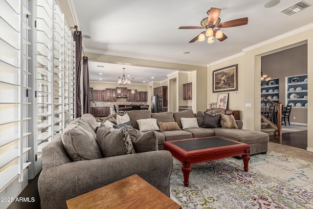 4463 S Oregon Ct, Chandler, AZ 85248 - living area featuring a chandelier, a ceiling fan, crown molding, stairs, and dark wood-style floors
