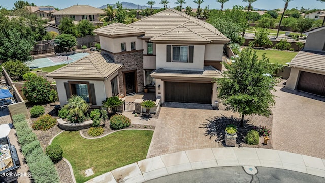 4463 S Oregon Ct, Chandler, AZ 85248 - prairie-style house with stucco siding, a tile roof, and decorative driveway