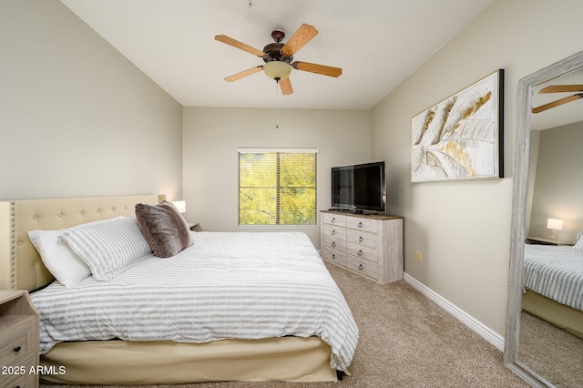 carpeted bedroom featuring baseboards and ceiling fan