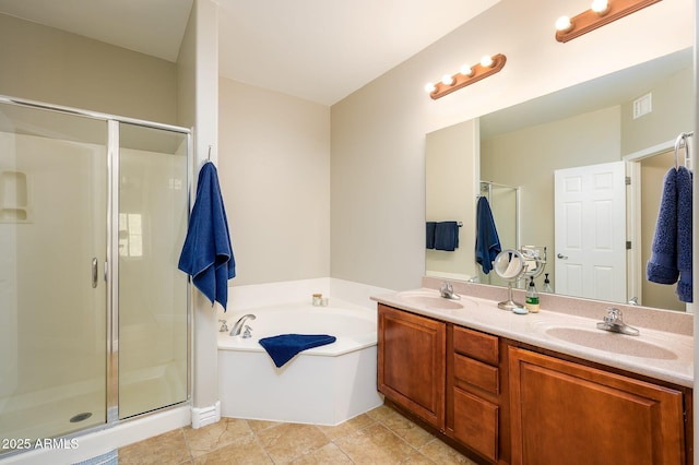 full bathroom with a shower stall, a bath, double vanity, and a sink