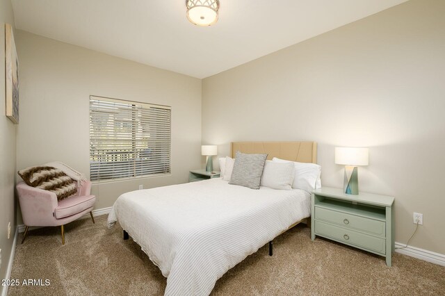 carpeted bedroom with baseboards