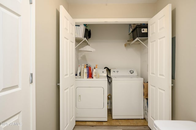 washroom with laundry area and washer and clothes dryer