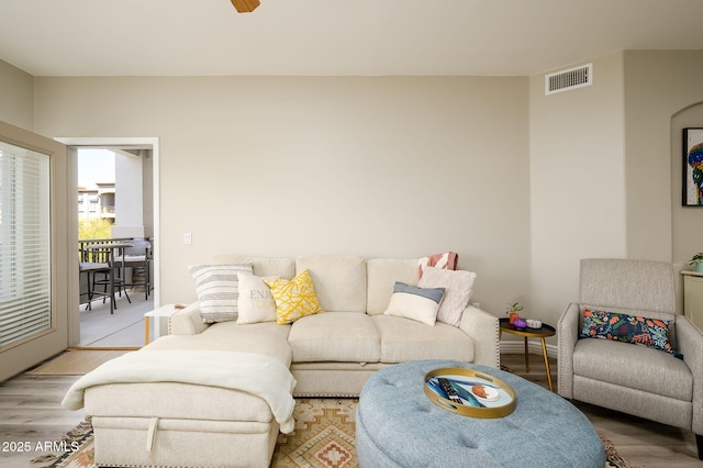 living room with visible vents and light wood finished floors