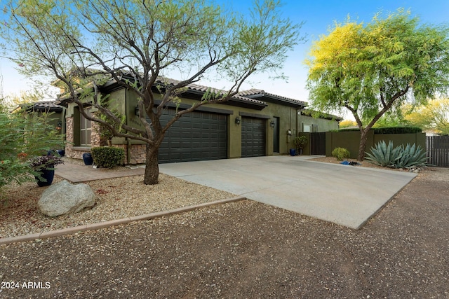 view of side of property with a garage