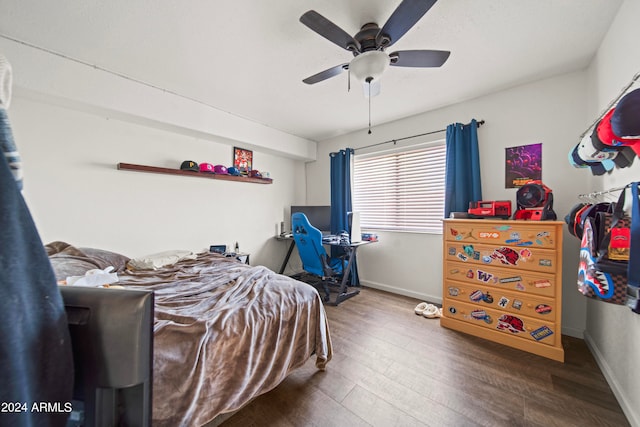 bedroom featuring ceiling fan and dark hardwood / wood-style floors