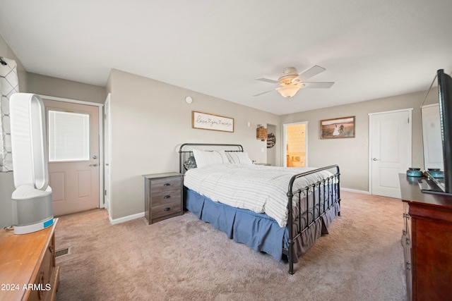 bedroom featuring ceiling fan and light carpet