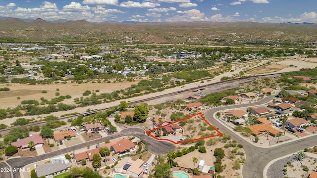 birds eye view of property with a mountain view