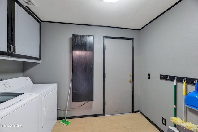 washroom featuring separate washer and dryer and cabinets