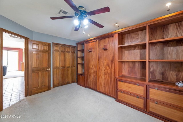 unfurnished bedroom featuring light carpet