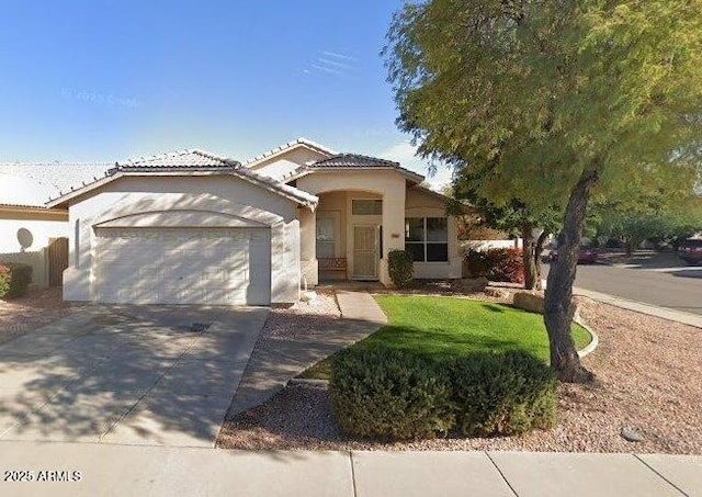 351 S Apache Dr, Chandler, AZ 85224 - mediterranean / spanish house featuring a garage, stucco siding, driveway, and a tile roof