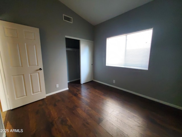 351 S Apache Dr, Chandler, AZ 85224 - unfurnished bedroom with lofted ceiling, dark wood finished floors, a closet, and baseboards