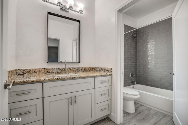 full bathroom featuring shower / tub combination, vanity, toilet, and wood finished floors