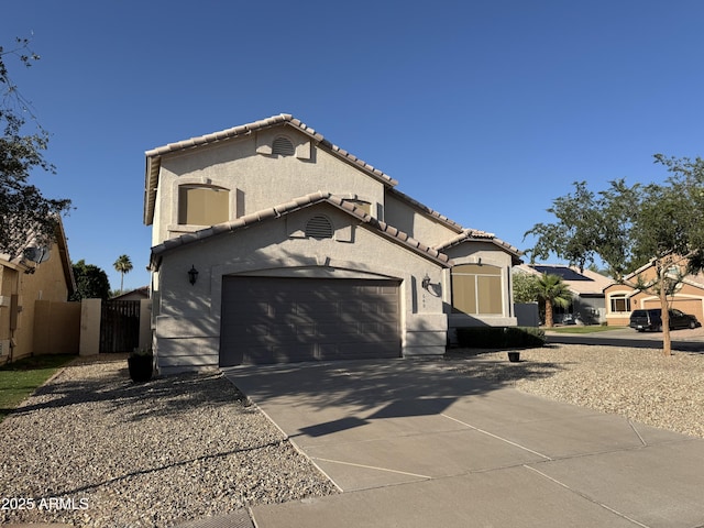 640 W Country Estates Ave, Gilbert, AZ 85233 - view of side of property featuring concrete driveway, a tile roof, stucco siding, a gate, and an attached garage