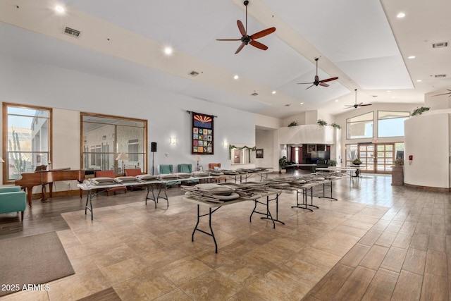 playroom featuring high vaulted ceiling