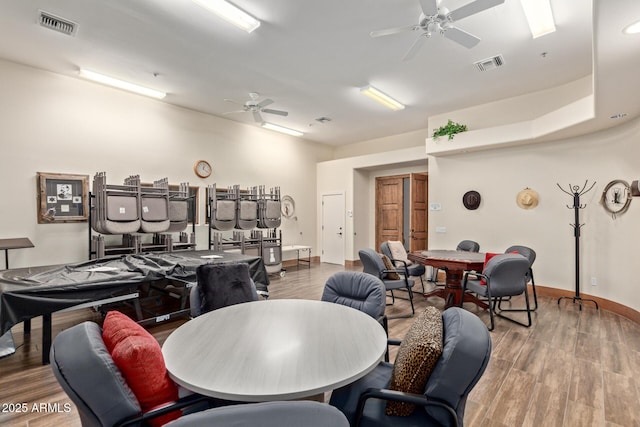 dining area featuring hardwood / wood-style floors and ceiling fan