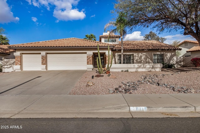 6118 E Star Valley St, Mesa, AZ 85215 - view of front of property featuring driveway, a chimney, a tiled roof, an attached garage, and brick siding