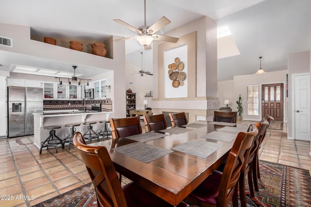6118 E Star Valley St, Mesa, AZ 85215 - dining space featuring light tile patterned floors, visible vents, high vaulted ceiling, and a ceiling fan