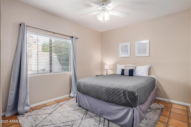 6118 E Star Valley St, Mesa, AZ 85215 - bedroom with a ceiling fan, tile patterned flooring, and baseboards
