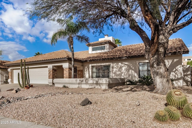 6118 E Star Valley St, Mesa, AZ 85215 - view of front of home with a garage, a tiled roof, a chimney, and stucco siding