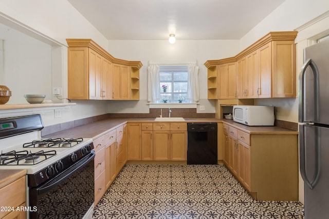 kitchen featuring gas stove, white microwave, open shelves, freestanding refrigerator, and dishwasher